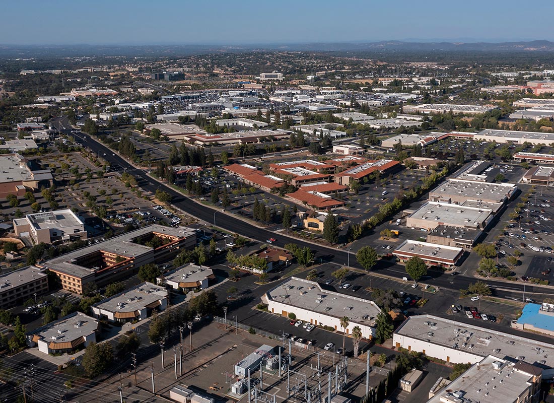 Roseville, CA - Aerial View of Roseville, CA on a Sunny Day With Mountains in the Far Background