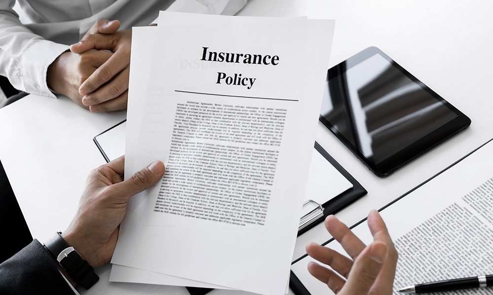 What Is A Hard Market - Close-up of Two People Reviewing Documents